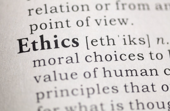 Close-up of the word "Ethics" and its dictionary definition, highlighting moral choices and values — foundational concepts in ethical fashion.